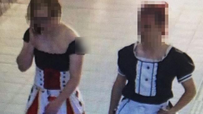 Two cross-dressing men have handed back a policeman’s cap after they allegedly took it while passing through Boronia railway station on October 30. Picture: Victoria Police.