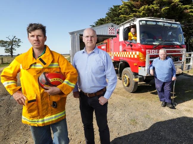 Mr Van Dijk with MP Danny O’Brien in front of the humble tin shed. Picture: Ian Currie