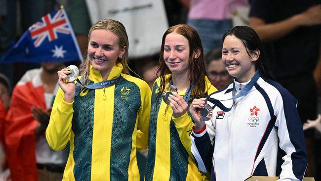 Gold medallist Australia's Mollie O'Callaghan silver medallist Australia's Ariarne Titmus and bronze medallist Hong Kong's Haughey Siobhan Bernadette pose with their medals on the podium of the women's 200m freestyle swimming event. Picture: Jonathan Nackstrand