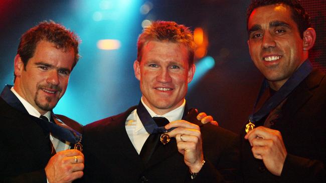 23/09/2003 PIRATE: Footballer (l-r) Mark Ricciuto with Nathan Buckley and Adam Goodes after winning Brownlow Medal at Crown Casino 22 Sep 2003.