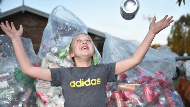 Caboolture nine-year-old Reegan Pellowe is collecting cans and bottles to raise money for sick children. Photo: Luke Simmonds.