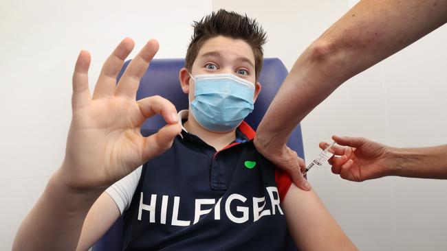 Archer Miller, 12, receives his Pfizer vaccination after the vaccine rollout was expanded. Picture: David Caird