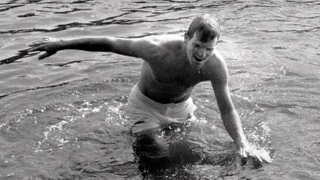 Courier emerging from the Yarra River after diving in to celebrate his victory in the Australian Open.