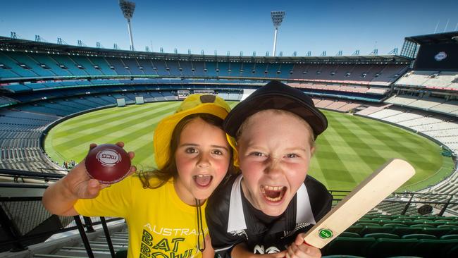 Gretel, 8, and Holly, 11, prepare for the Boxing Day Test at the MCG. Picture: Jay Town