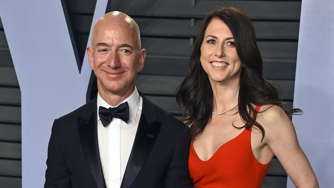 FILE - In this March 4, 2018 file photo, Jeff Bezos and wife MacKenzie Bezos arrive at the Vanity Fair Oscar Party in Beverly Hills, Calif. Jeff Bezos and MacKenzie, announced Thursday, April 4, 2019, in a series of tweets that they have finalized their divorce, ending a 25-year marriage that played a role in the creation of the online shopping giant. (Photo by Evan Agostini/Invision/AP, File)