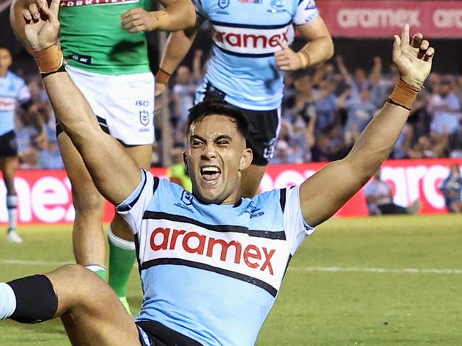 SYDNEY, AUSTRALIA - MARCH 31: Kayal Iro of the Sharks celebrates scoring a try during the round four NRL match between Cronulla Sharks and Canberra Raiders at PointsBet Stadium, on March 31, 2024, in Sydney, Australia. (Photo by Cameron Spencer/Getty Images)