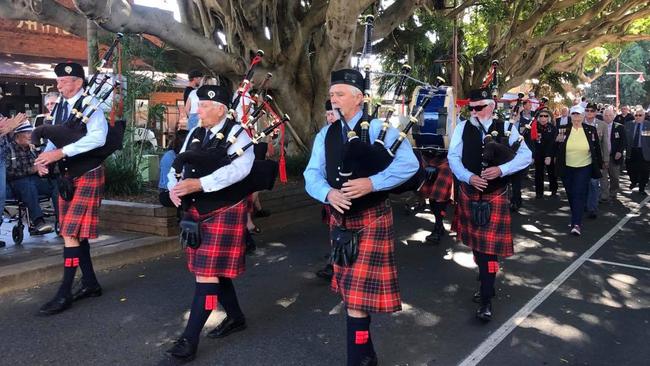 Bagpipes passing under Sawtell's iconic fig trees on First Ave.