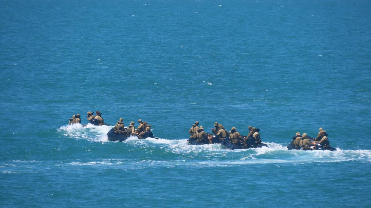 Conducting their own training in Darwin Harbour, Australian Army soldiers had a fantastic view of the departing warships. Picture: Harry Brill.