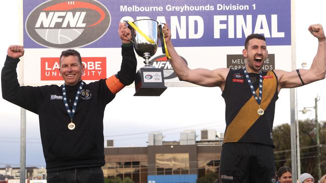 Heidelberg coach Danny Nolan and captain Sam Gilmore celebrate last year’s success. The team is on track this year to win again. Photo: Hamish Blair