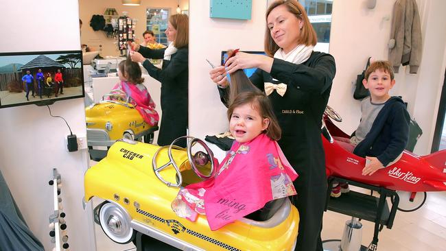 Carlo &amp; Elise, a new kids' hair salon, has opened in Mosman. Ando Szalai with Isla Pope 2 and Hugo 5. Photo: Adam Ward