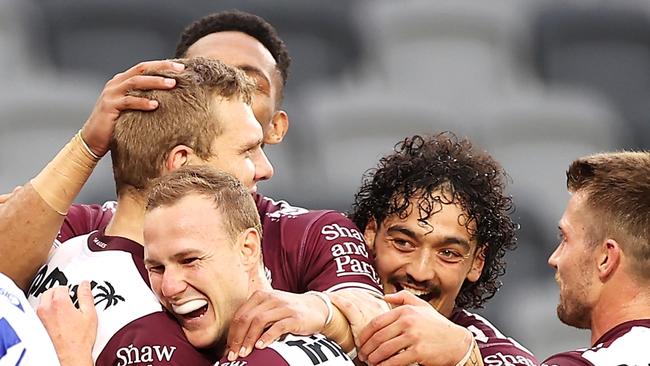 SYDNEY, AUSTRALIA - JULY 03: Tom Trbojevic of the Sea Eagles celebrates with his team mates after scoring a try during the round 16 NRL match between the Canterbury Bulldogs and the Manly Sea Eagles at Stadium Australia, on July 03, 2021, in Sydney, Australia. (Photo by Mark Kolbe/Getty Images)