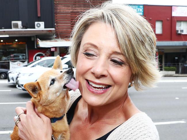 Labor candidate Kristina Keneally gets a kiss from Smarty outside the Epping railway station on the last day of campaigning in the Bennelong by-election. Picture: John Feder/The Australian.