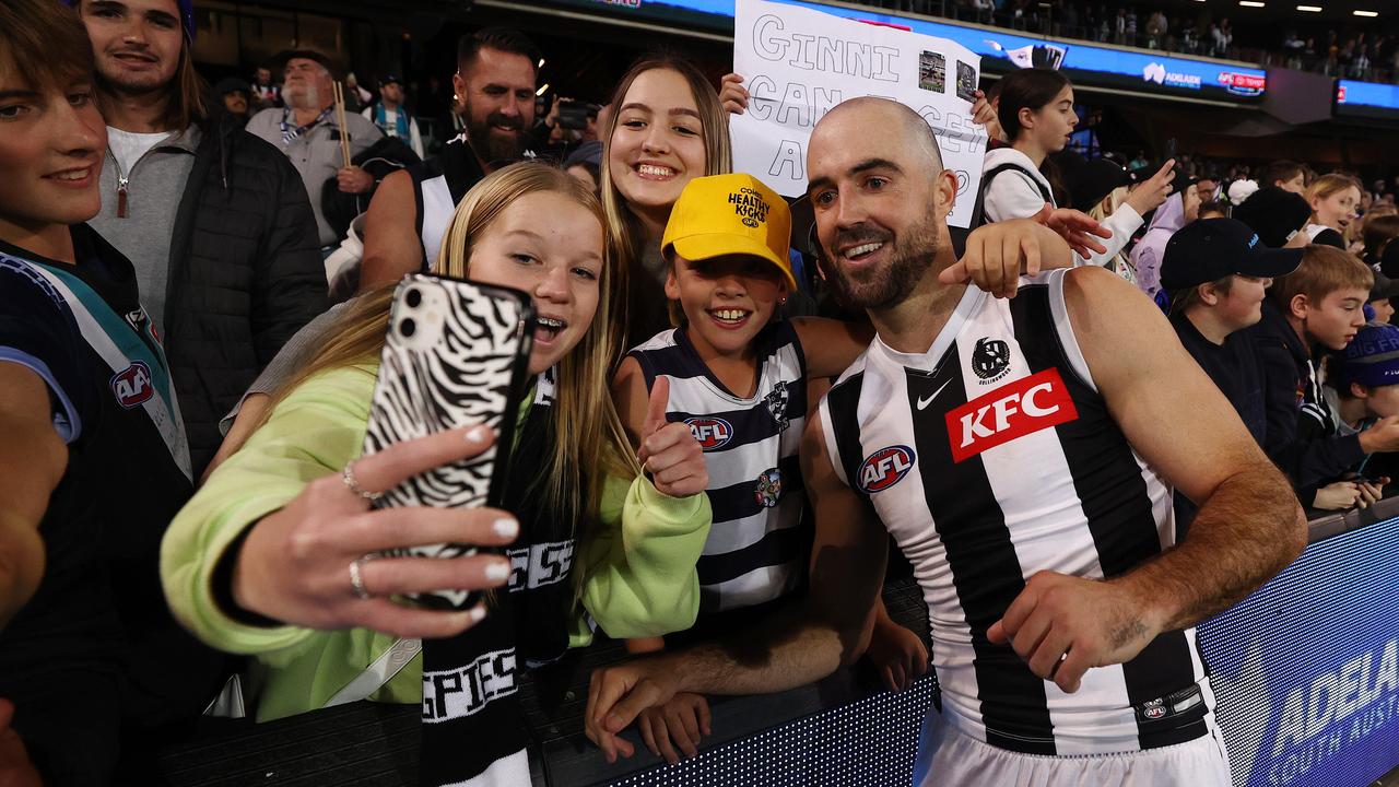 Business leaders say the rising anti-social behaviour blighted major events such as the Gather Round where Steele Sidebottom of the Collingwood Magpies is photographed posing with fans after his side’s win against St Kilda. Picture: Michael Klein