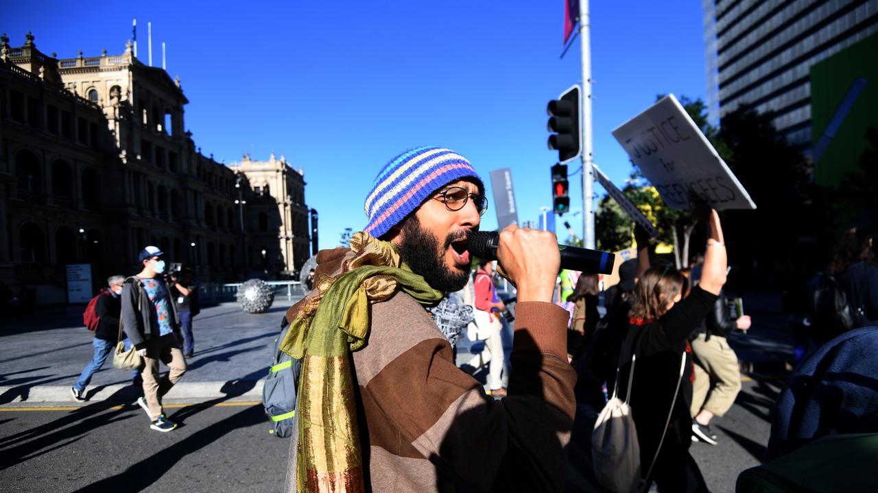 The Gabba councillor Jonathan Sri chants slogans during a refugee protest march in Brisbane. Photo: NCA NewsWire/Dan Peled