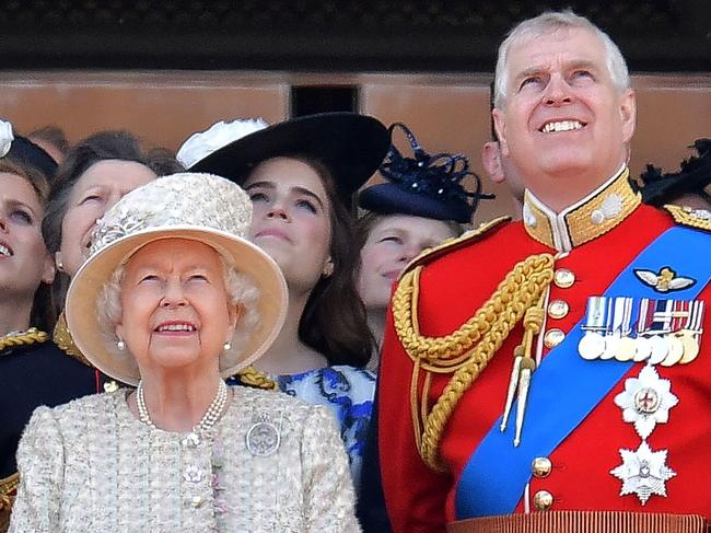 (FILES) In this file photo taken on June 08, 2019 (L-R) Britain's Prince Charles, Prince of Wales, Britain's Queen Elizabeth II, and Britain's Prince Andrew, Duke of York stand with other members of the Royal Family on the balcony of Buckingham Palace to watch a fly-past of aircraft by the Royal Air Force, in London. - Prince Andrew on November 20, 2019 said he was cancelling his public engagements, as the outcry from the British royal's friendship with convicted sex offender Jeffrey Epstein showed no sign of abating. (Photo by Daniel LEAL-OLIVAS / AFP)