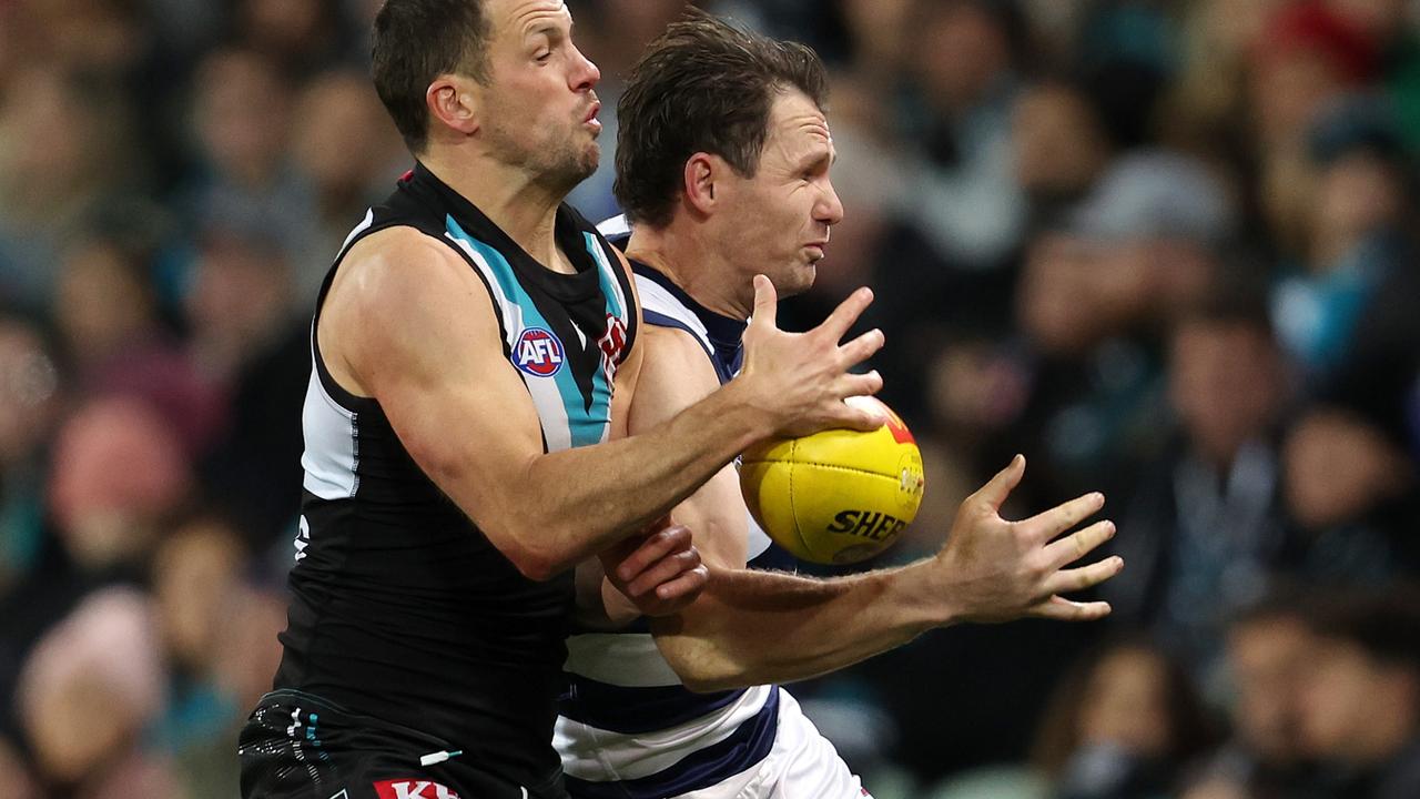 Travis Boak collides with Patrick Dangerfield. Picture: Sarah Reed/AFL Photos via Getty Images