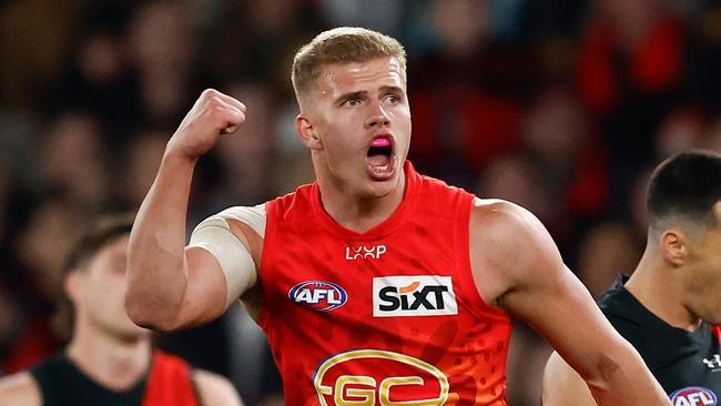 MELBOURNE, AUSTRALIA - AUGUST 10: Jed Walter of the Suns celebrates a goal during the 2024 AFL Round 22 match between the Essendon Bombers and the Gold Coast SUNS at Marvel Stadium on August 10, 2024 in Melbourne, Australia. (Photo by Michael Willson/AFL Photos via Getty Images)