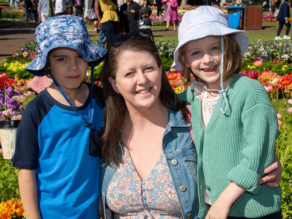 Ollie Desribes (left), Jess Schulz and Everly Schulz in Queens Park. Carnival of FlowersSaturday September 16, 2023