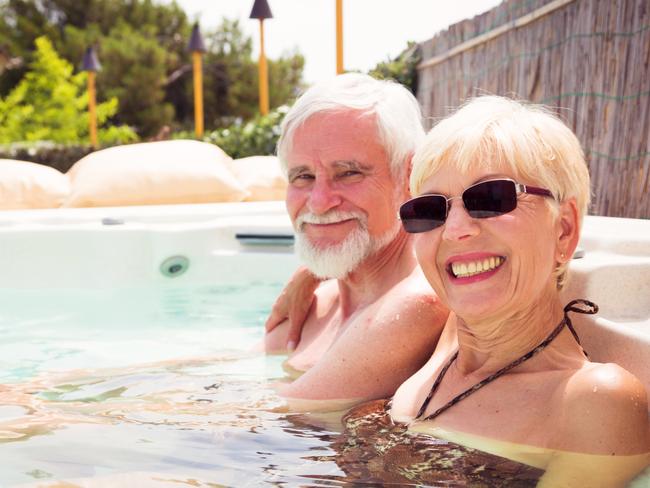 senior couple having a good time at the pool.  Retirees retirement generic.