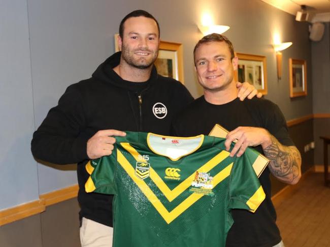 Boyd Cordner presents Jake Friend his Kangaroos jersey.