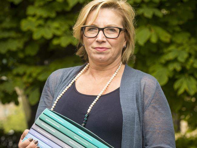 Domestic violence campaigner Rosie Batty with the report. Picture: Eugene Hyland