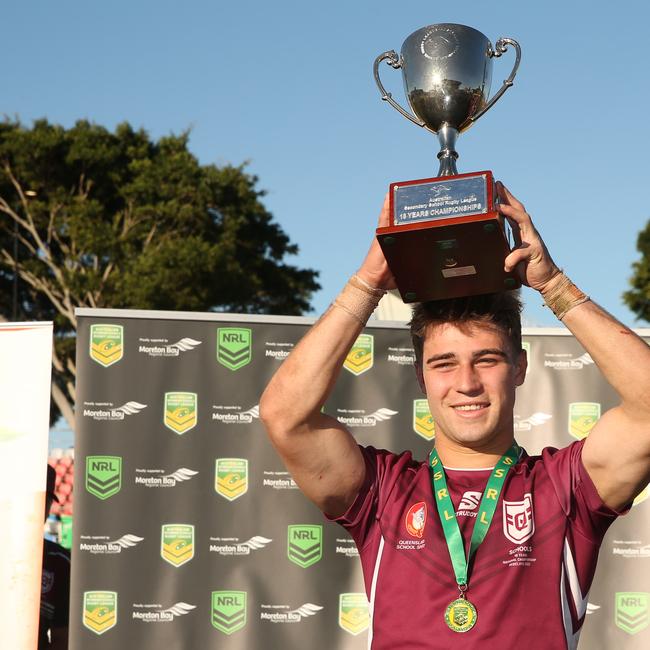 QLD captain Jye Gray lifts the championship trophy Picture: Zak Simmonds