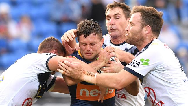 Mitch Rein is held up during Gold Coast’s 6-4 loss to North Queensland last week. Picture: AAP/Dave Hunt