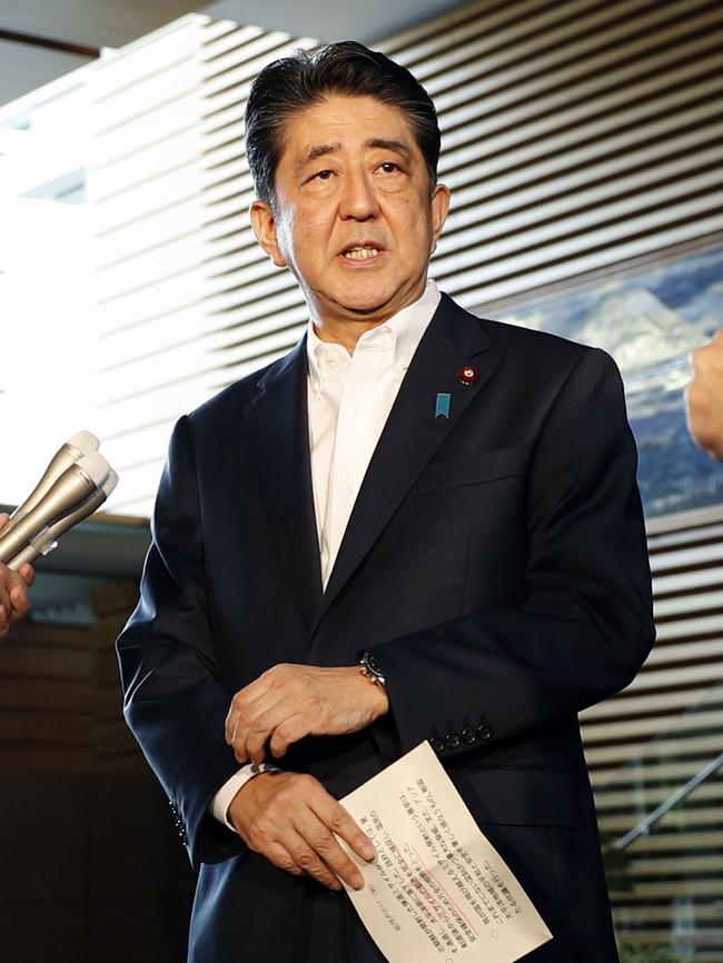 Japanese Prime Minister Shinzo Abe talks to the media following yesterday’s launch over Japan.