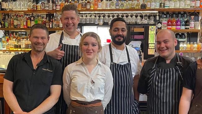 Cheeky Goose Cafe owner Rob van den Brink (second left) with staff members Matt, Alex, Manbir, Sam and Jackson in happier times.