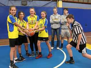 L-PLATE REFEREE: Lismore Storm Basketball Club has a new generation of referees in training - L-R Emily Simpson, 12 Jackie Andonov, 11, Jazlee Brennan, 11, and Alexis Nott, hold the ball while coaches Kiara Richardson and Jacob Leu watch, while Isaac McWhirter , 15, whistles. Picture: Alison Paterson