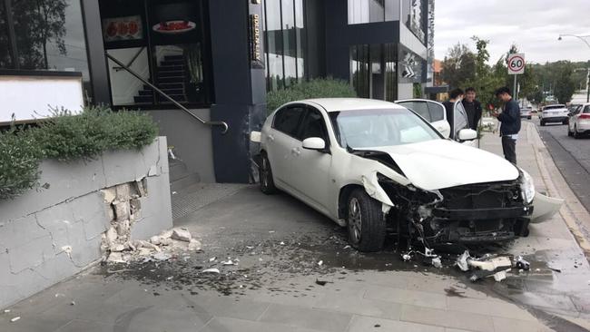 The car came to a stop on the footpath outside The Chen hotel.