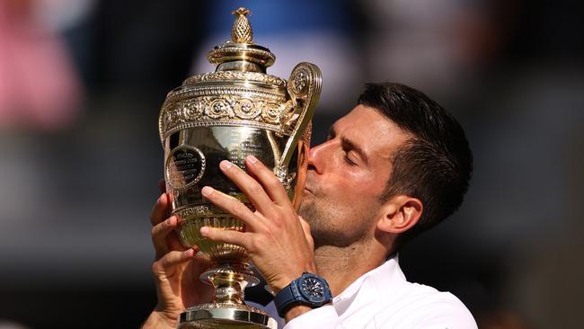 Novak Djokovic of Serbia kisses the troph