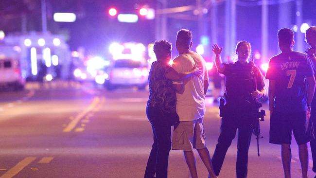 Police officers direct family members away from the shooting at Pulse nightclub in 2016. (AP Photo/Phelan M. Ebenhack)