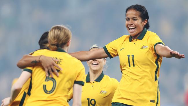 Mary Fowler of the Matildas celebrates scoring a goal with teammates