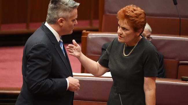 Minister for Finance Mathias Cormann and One Nation leader Senator Pauline Hanson after the Backpacker Tax Bill vote in the Senate at Parliament House in Canberra. Picture: Mick Tsikas