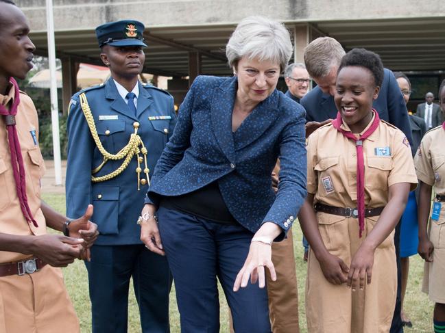Prime Minister Theresa May in breaks into dance whilst meeting with scouts at the United Nations offices in Nairobi on the third day of her visit to Africa. (Photo by Stefan Rousseau/PA Images via Getty Images)