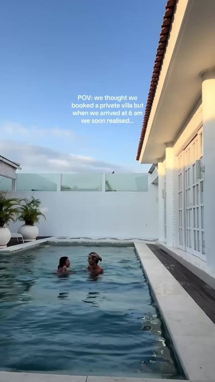 Moment skinny dipping pals dive naked into pool they thought was their private sanctuary
