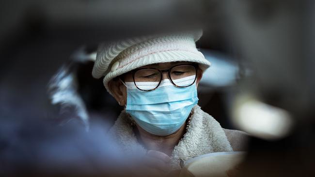 A woman pictured wearing a mask in Melbourne where face coverings are now mandatory. Picture: Darrian Traynor/Getty