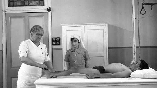 Sister Elizabeth Kenny demonstrating her therapy for polio patients to another nursing sister in a hospital in Queensland in 1939. Photo: John Oxley Library, State Library of Queensland