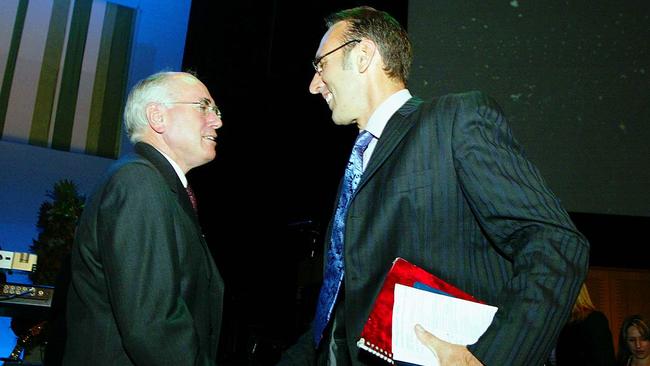 Then-Prime Minister John Howard shaking Mr Houston's hand after opening the Hillsong headquarters in October 2002.