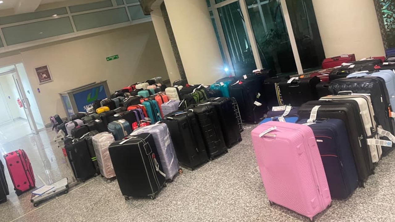 The couple’s bags were not found among a pile of lost baggage flown to Bali. Picture: Facebook