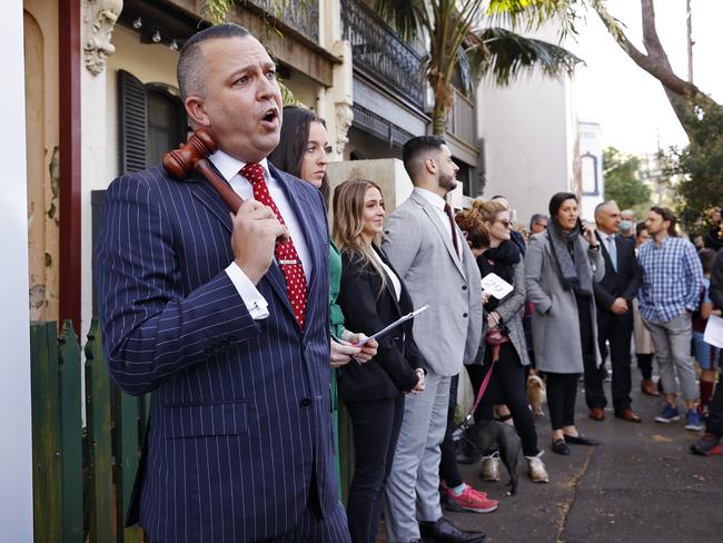 WEEKEND TELEGRAPHS - 6/8/22MUST CLEAR WITH PIC EDITOR JEFF DARMANIN BEFORE PUBLISHING -Auction of dilapidated terrace at 362 Wilson St, Darlington NSW this morning which was sold under the hammer for $1.83M by auctioneer Clarence White (pictured). Picture: Sam Ruttyn