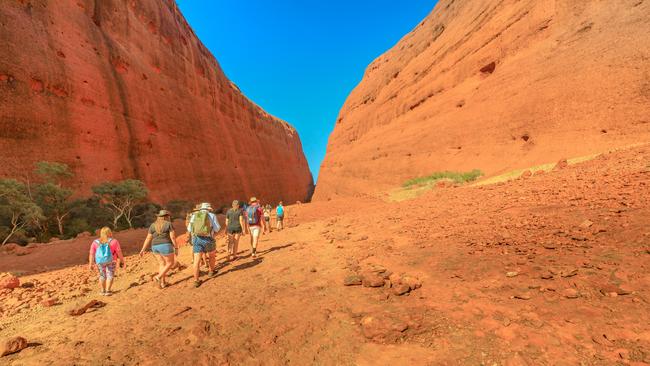 People walking towards two tallest domes of Walpa Gorge entrance in Uluru-Kata Tjuta National Park. Picture: File