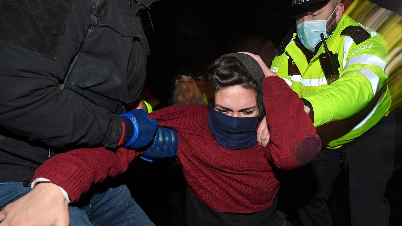 Police officers scuffled with mourners, with several women arrested. Picture: Justin Tallis/AFP