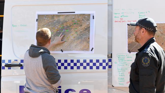 Police map out search areas at the couple’s Manna Hill property. Picture: Naomi Jellicoe