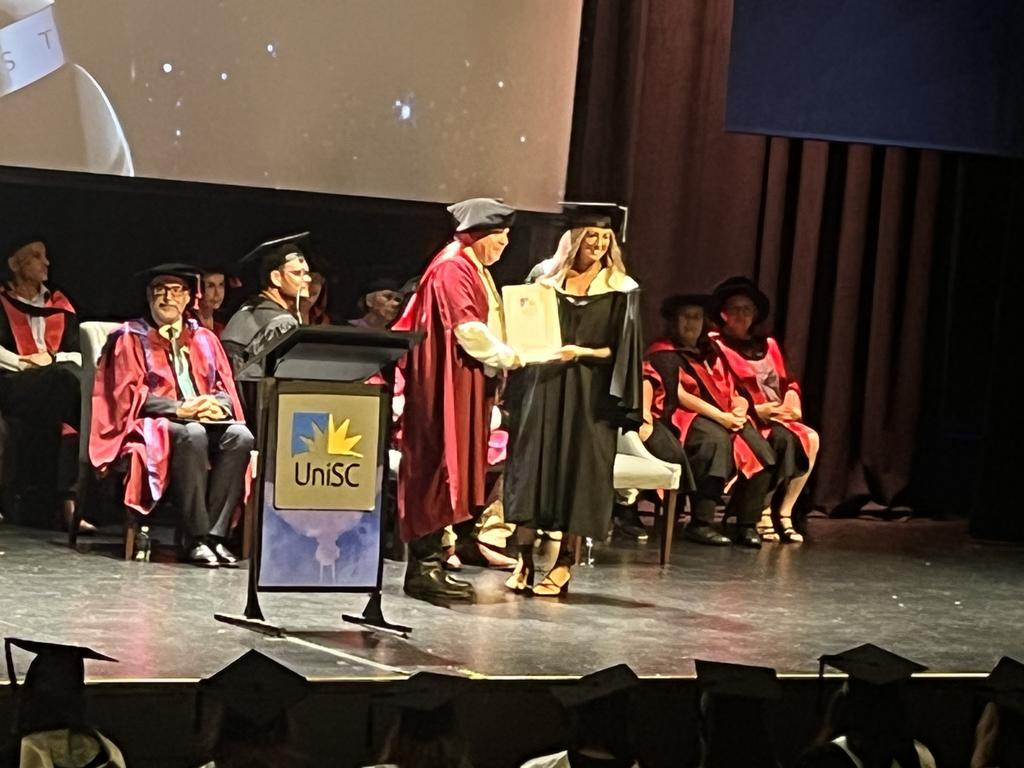 Graduates from the University of the Sunshine Coast's Fraser Coast campus celebrating at the Brolga Theatre.