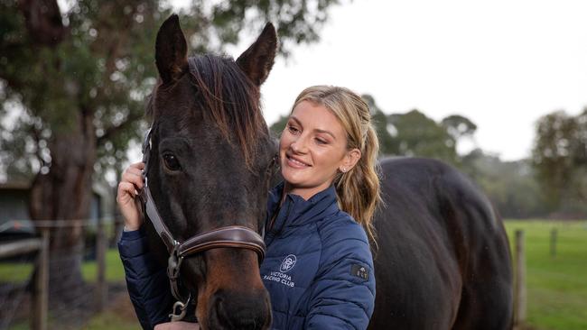 Jockey Jamie Kah at home on the Mornington Peninsula with her horse Brax. Picture: Mark Stewart