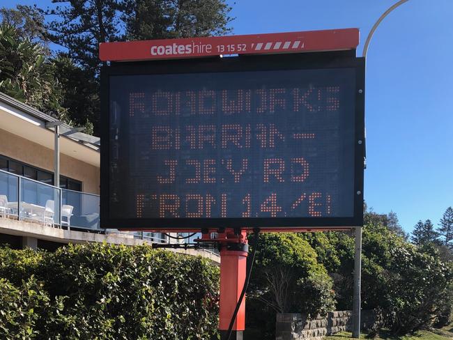 A mobile RMS sign at Palm Beach advising motorists of upcoming roadworks on Barrenjoey Rd. Picture: Jim O'Rourke