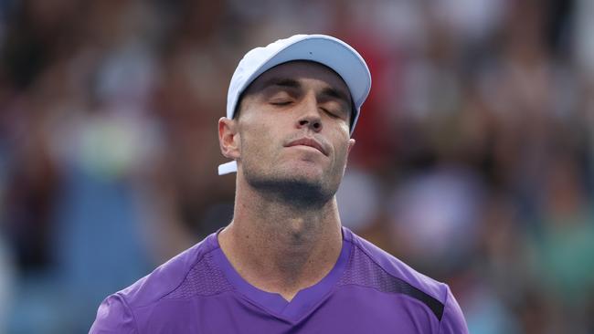 MELBOURNE, AUSTRALIA – JANUARY 14: Christopher O'Connell of Australia reacts in their round one singles match against Cristian Garin of Chile during day one of the 2024 Australian Open at Melbourne Park on January 14, 2024 in Melbourne, Australia. (Photo by Phil Walter/Getty Images)