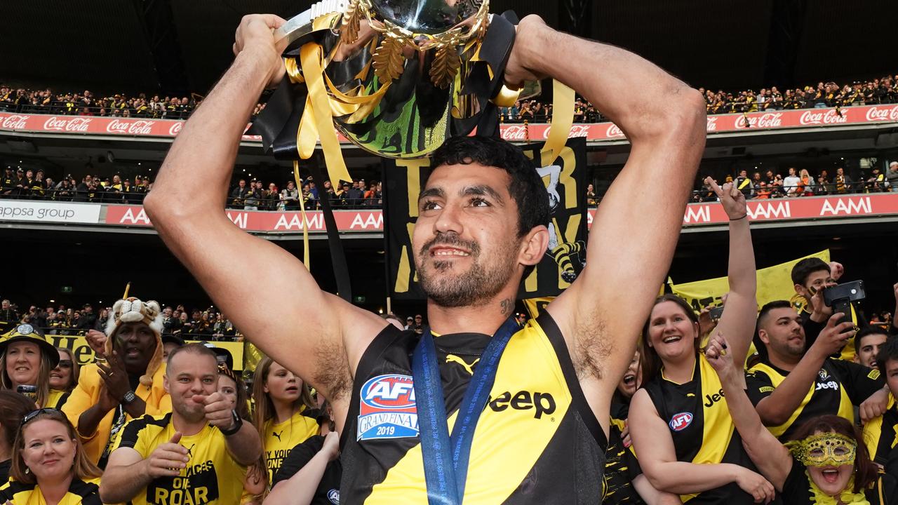 Marlion Pickett of the Tigers celebrates the win with the Premiership Cup during the 2019 AFL Grand Final between the Richmond Tigers and the GWS Giants at the MCG in Melbourne, Saturday, September 28, 2019. (AAP Image/Michael Dodge) NO ARCHIVING